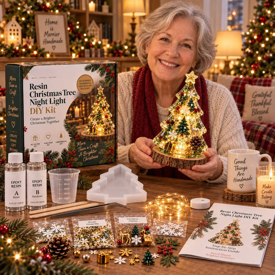 Woman holding a completed glowing resin Christmas tree next to the boxed DIY kit