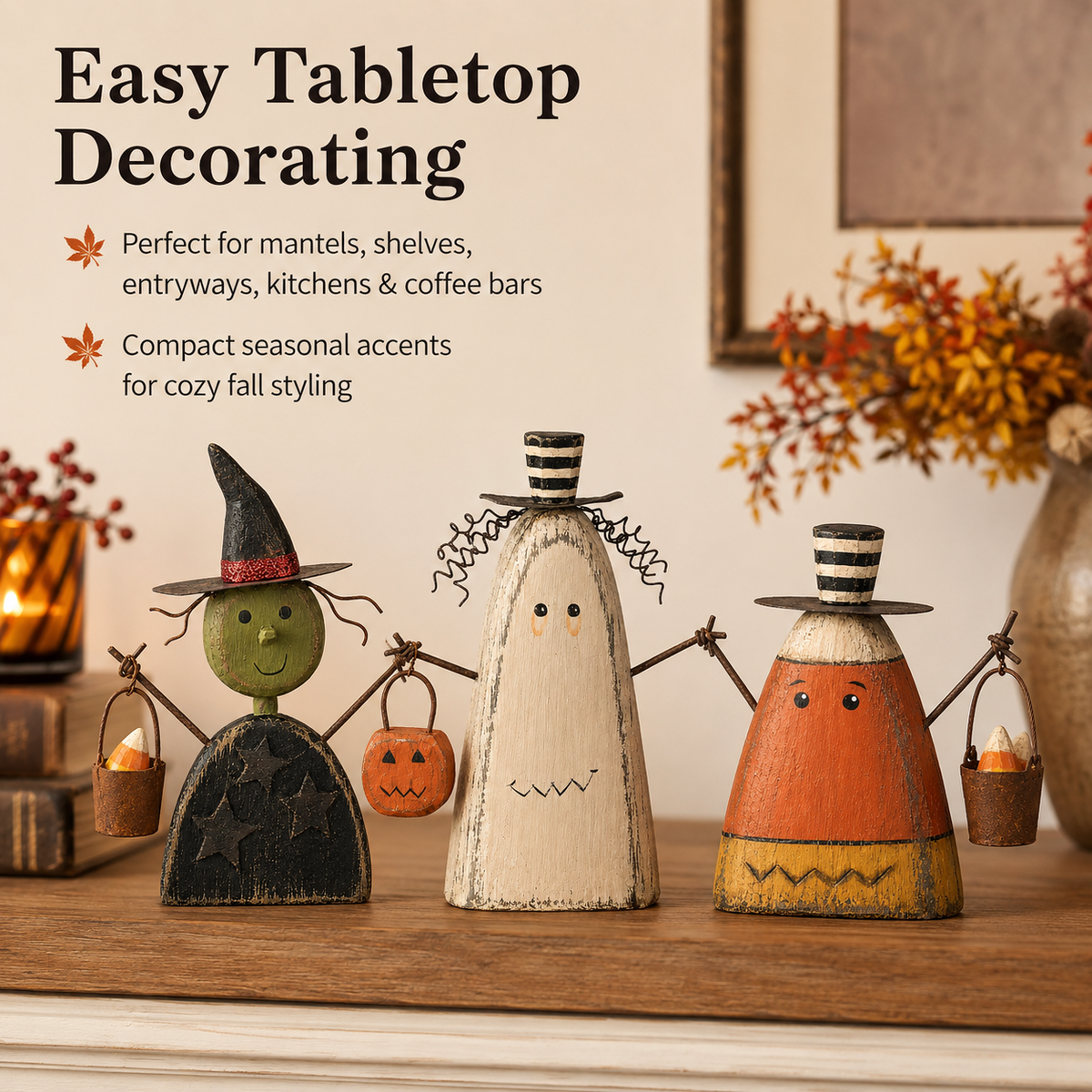 Three small Halloween figurines arranged on a shelf or tabletop