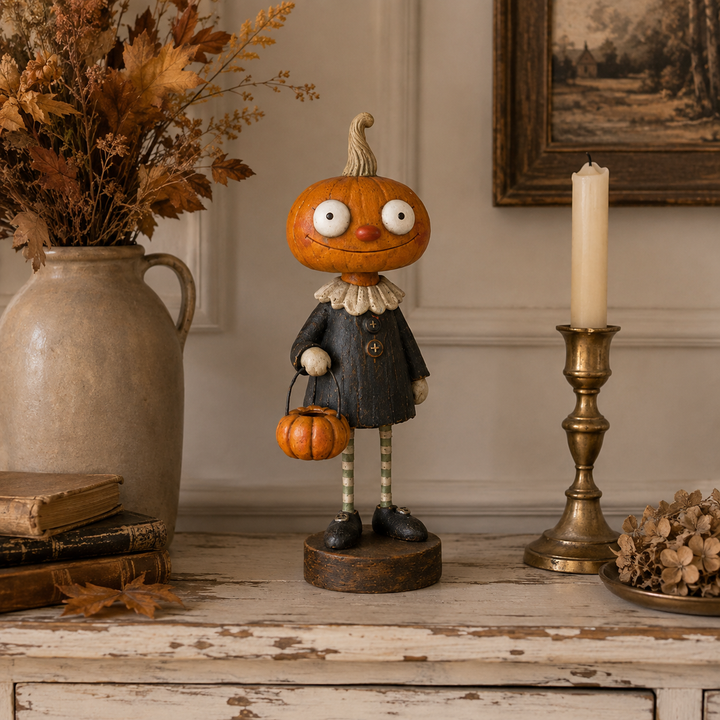 Pumpkin Boy with a distressed dark coat and a tiny pumpkin bucket