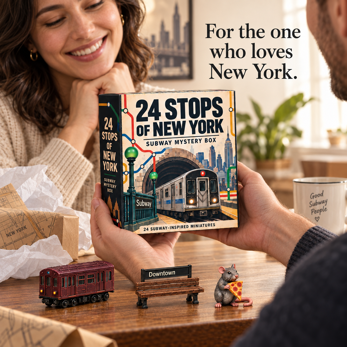 Two adults exchanging the illustrated 24 Stops of New York gift box